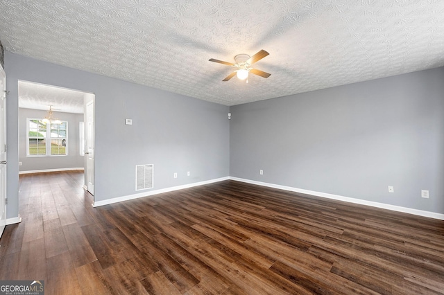 4413 Pinscher St, Union City, GA 30291 - empty room with a textured ceiling, visible vents, baseboards, ceiling fan with notable chandelier, and dark wood-type flooring