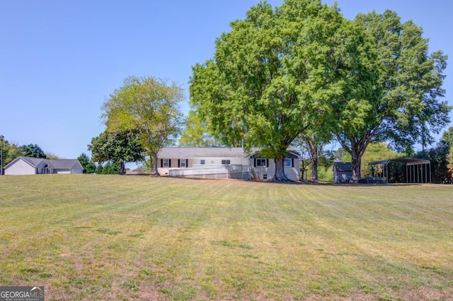 view of yard with a detached carport