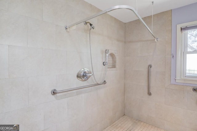 full bath featuring a tile shower