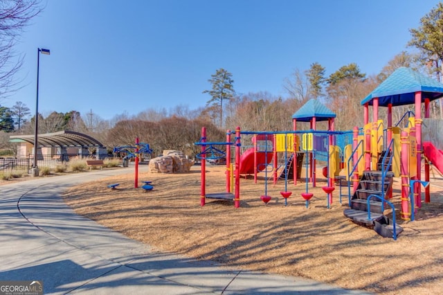 community jungle gym featuring fence