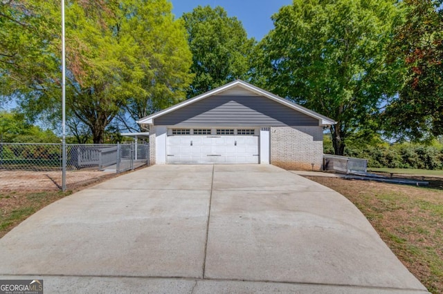 exterior space with fence and driveway