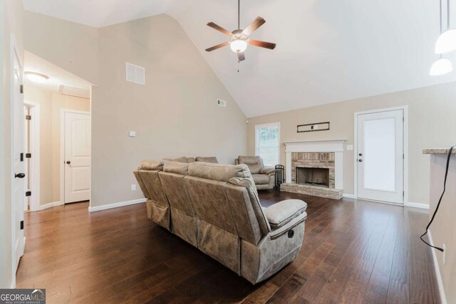 204 Arapahoe Ct, Villa Rica, GA 30180 - living room featuring dark wood-type flooring, visible vents, a ceiling fan, and high vaulted ceiling