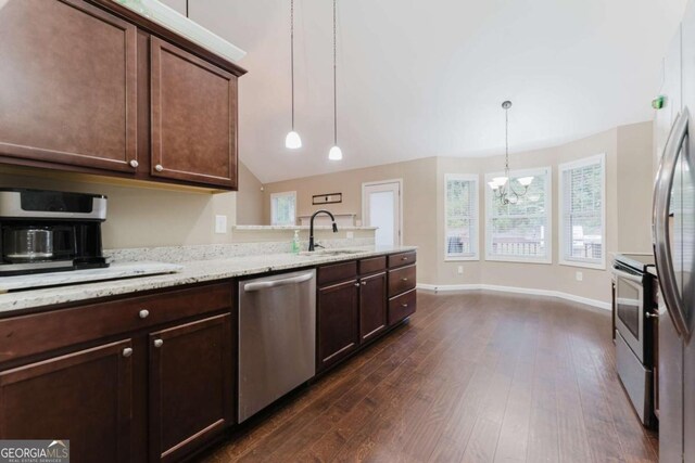 204 Arapahoe Ct, Villa Rica, GA 30180 - kitchen with dark brown cabinets, a sink, appliances with stainless steel finishes, dark wood finished floors, and a notable chandelier