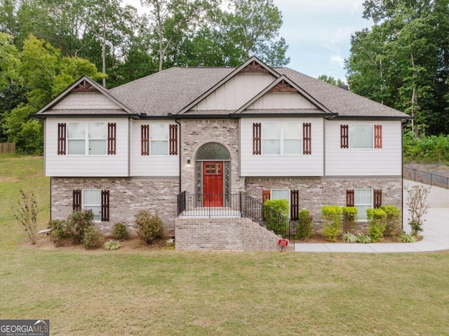 204 Arapahoe Ct, Villa Rica, GA 30180 - raised ranch featuring brick siding, roof with shingles, and a front yard