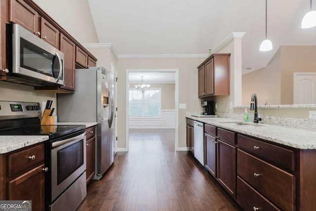 204 Arapahoe Ct, Villa Rica, GA 30180 - kitchen featuring stainless steel appliances, a sink, a chandelier, dark wood-type flooring, and ornamental molding