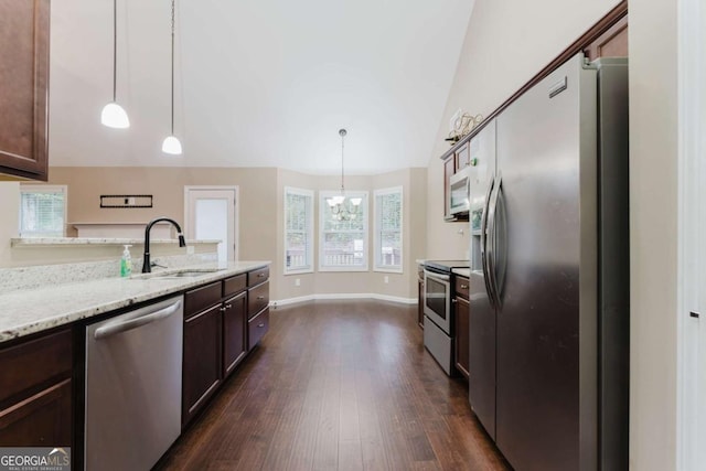 204 Arapahoe Ct, Villa Rica, GA 30180 - kitchen featuring an inviting chandelier, dark brown cabinets, a sink, appliances with stainless steel finishes, and dark wood-style flooring