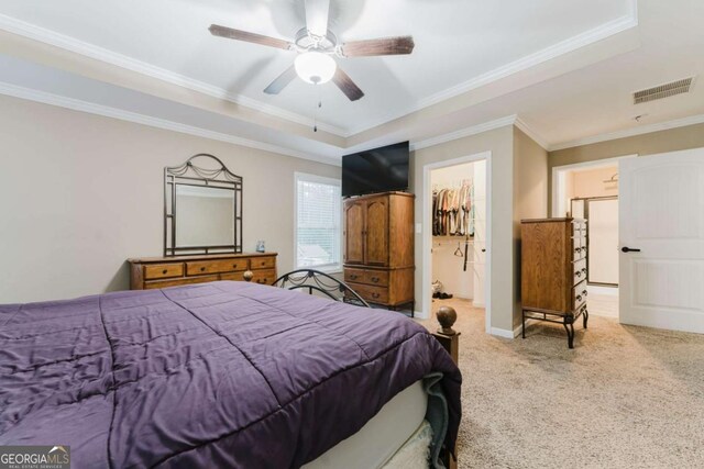 204 Arapahoe Ct, Villa Rica, GA 30180 - carpeted bedroom with a raised ceiling, baseboards, visible vents, ceiling fan, and ornamental molding