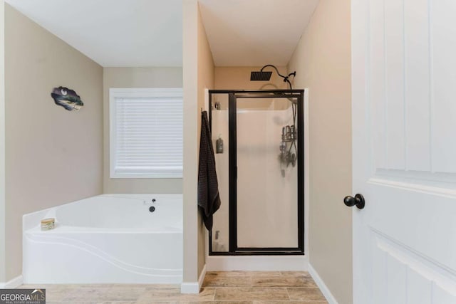 204 Arapahoe Ct, Villa Rica, GA 30180 - bathroom with a bath, baseboards, and a shower stall