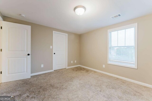 204 Arapahoe Ct, Villa Rica, GA 30180 - carpeted spare room featuring baseboards and visible vents