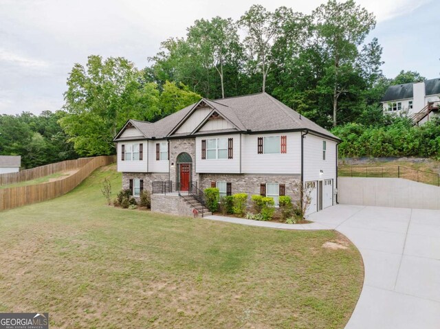 204 Arapahoe Ct, Villa Rica, GA 30180 - bi-level home with an attached garage, fence, driveway, and a front yard