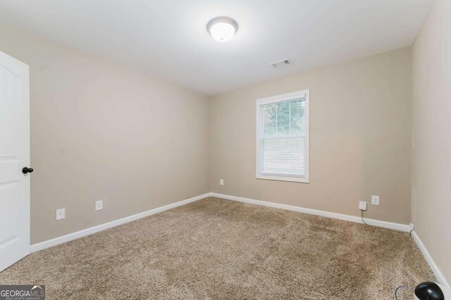 204 Arapahoe Ct, Villa Rica, GA 30180 - unfurnished room featuring carpet, visible vents, and baseboards