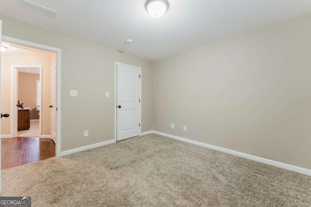 204 Arapahoe Ct, Villa Rica, GA 30180 - unfurnished bedroom with carpet floors, visible vents, and baseboards