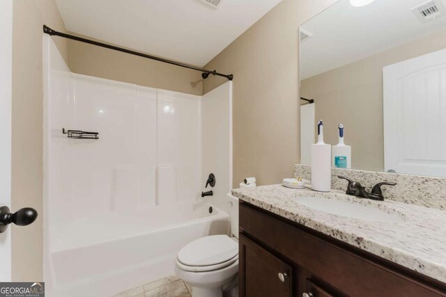 204 Arapahoe Ct, Villa Rica, GA 30180 - bathroom with toilet, visible vents, shower / bath combination, tile patterned flooring, and vanity