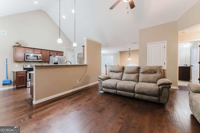 204 Arapahoe Ct, Villa Rica, GA 30180 - living room featuring a ceiling fan, baseboards, high vaulted ceiling, and dark wood-type flooring