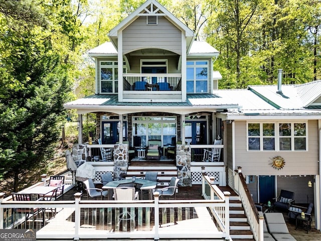 2 Blue Heron Dr, Monticello, GA 31064 - back of house with stairs, metal roof, and a balcony