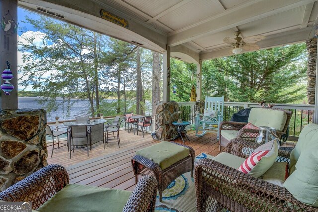 2 Blue Heron Dr, Monticello, GA 31064 - wooden terrace with a water view, outdoor lounge area, a ceiling fan, and outdoor dining area