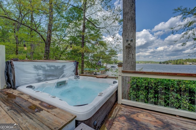 2 Blue Heron Dr, Monticello, GA 31064 - deck featuring a covered hot tub and a water view