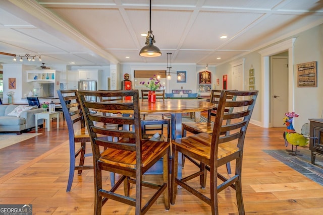 2 Blue Heron Dr, Monticello, GA 31064 - dining area featuring a wood stove, recessed lighting, coffered ceiling, and light wood-style floors