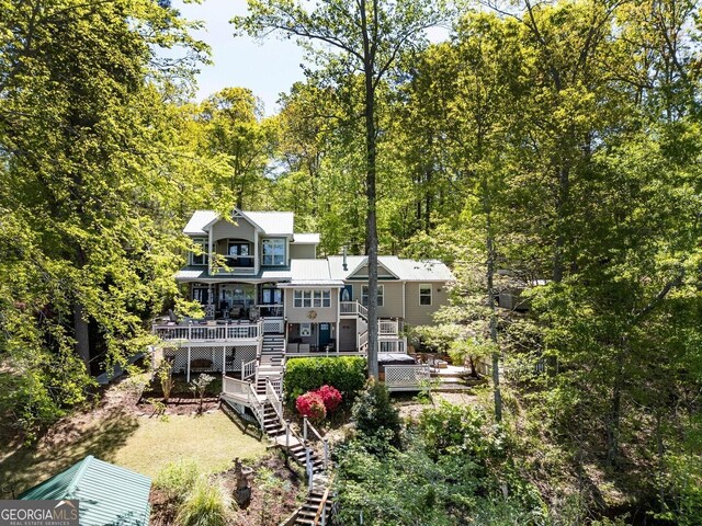 2 Blue Heron Dr, Monticello, GA 31064 - rear view of property with a forest view, a wooden deck, and stairs