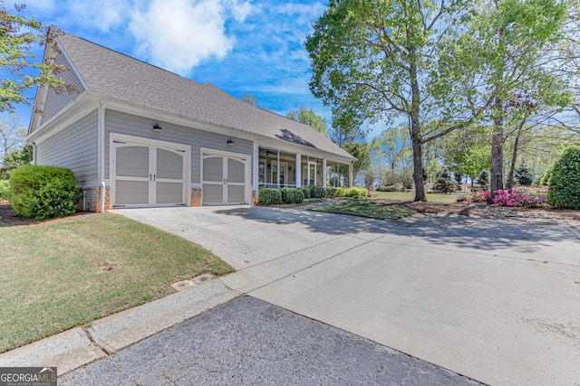 2616 Bent Pine Dr, Statham, GA 30666 - view of front facade with driveway, an attached garage, a front lawn, and roof with shingles