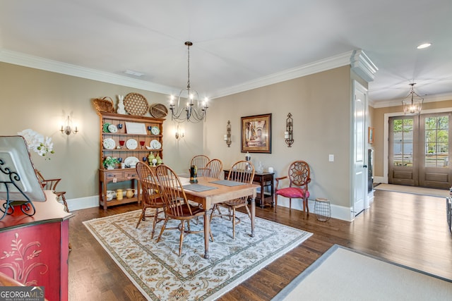 2616 Bent Pine Dr, Statham, GA 30666 - dining space featuring a chandelier, ornamental molding, and dark wood finished floors