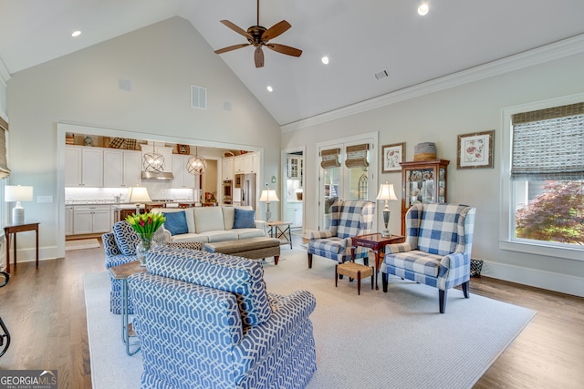 2616 Bent Pine Dr, Statham, GA 30666 - living area featuring high vaulted ceiling, ceiling fan, light wood-style floors, and recessed lighting