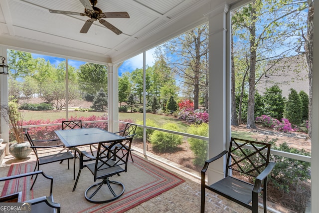 2616 Bent Pine Dr, Statham, GA 30666 - sunroom featuring ceiling fan, outdoor dining space, and view of wooded area