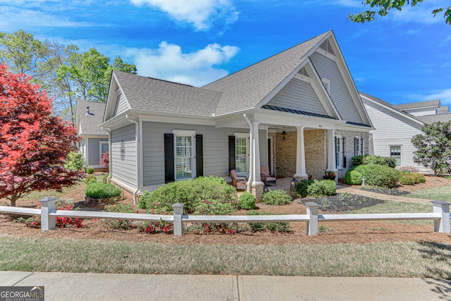 2616 Bent Pine Dr, Statham, GA 30666 - view of front of home with covered porch, roof with shingles, and a fenced front yard