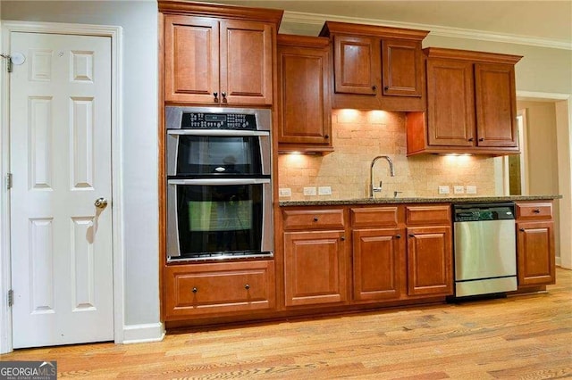 974 Regal Hills Ln, Mableton, GA 30126 - kitchen featuring stone counters, light wood-style floors, and appliances with stainless steel finishes