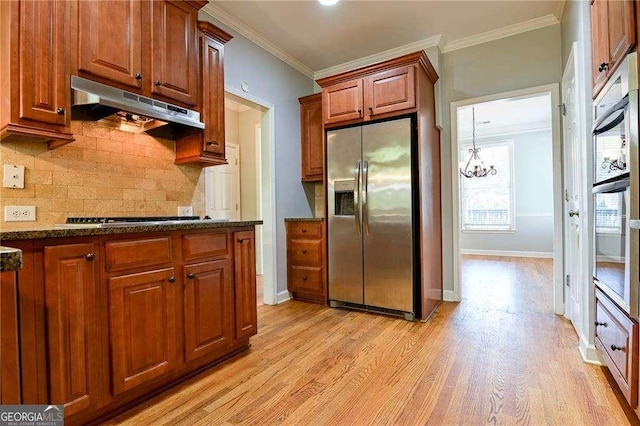 974 Regal Hills Ln, Mableton, GA 30126 - kitchen with tasteful backsplash, light wood-type flooring, ornamental molding, under cabinet range hood, and stainless steel appliances