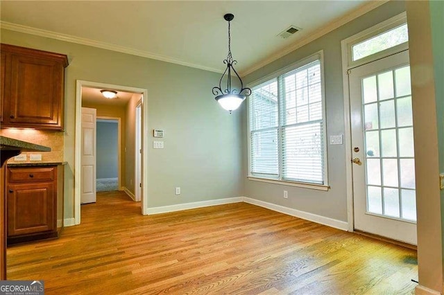 974 Regal Hills Ln, Mableton, GA 30126 - unfurnished dining area with ornamental molding, visible vents, light wood-style flooring, and a healthy amount of sunlight
