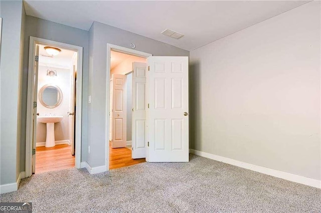 974 Regal Hills Ln, Mableton, GA 30126 - unfurnished bedroom featuring carpet floors, baseboards, and visible vents