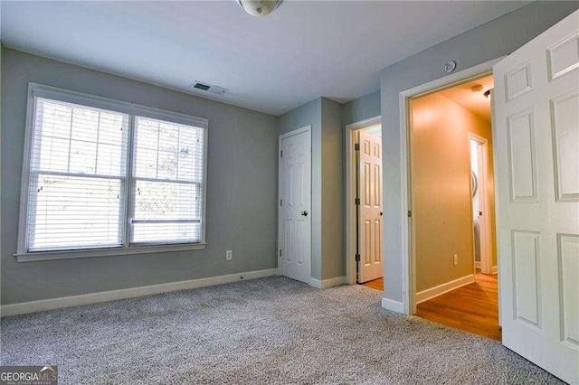 974 Regal Hills Ln, Mableton, GA 30126 - unfurnished bedroom with carpet, visible vents, and baseboards