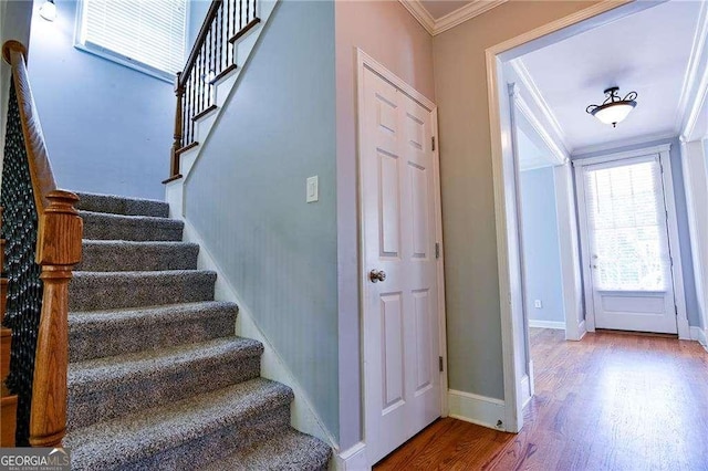974 Regal Hills Ln, Mableton, GA 30126 - stairway featuring baseboards, crown molding, and wood finished floors