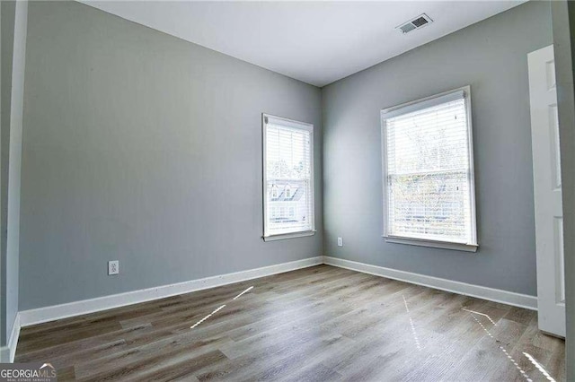 974 Regal Hills Ln, Mableton, GA 30126 - unfurnished room featuring wood finished floors, baseboards, and visible vents