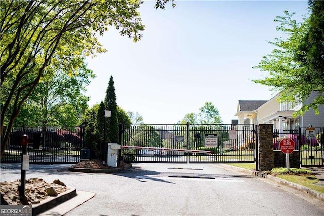 974 Regal Hills Ln, Mableton, GA 30126 - view of street featuring traffic signs, curbs, a gated entry, and a gate