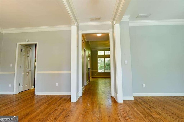 974 Regal Hills Ln, Mableton, GA 30126 - hall with crown molding, wood finished floors, baseboards, and visible vents
