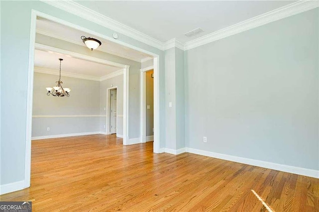 974 Regal Hills Ln, Mableton, GA 30126 - spare room featuring a chandelier, light wood-type flooring, baseboards, and ornamental molding