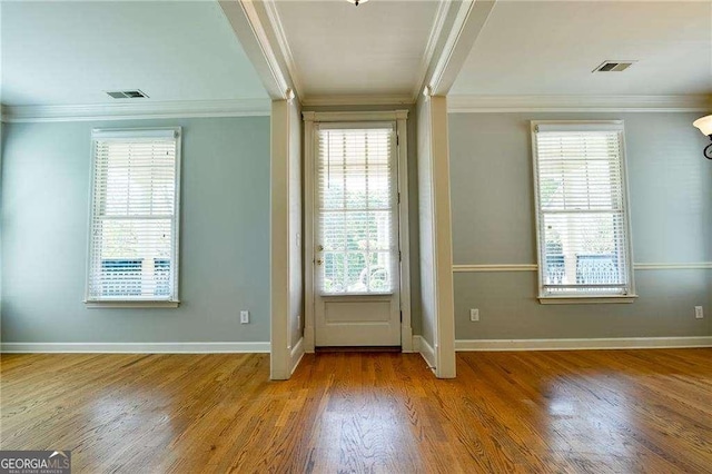 974 Regal Hills Ln, Mableton, GA 30126 - doorway featuring crown molding, visible vents, baseboards, and wood finished floors