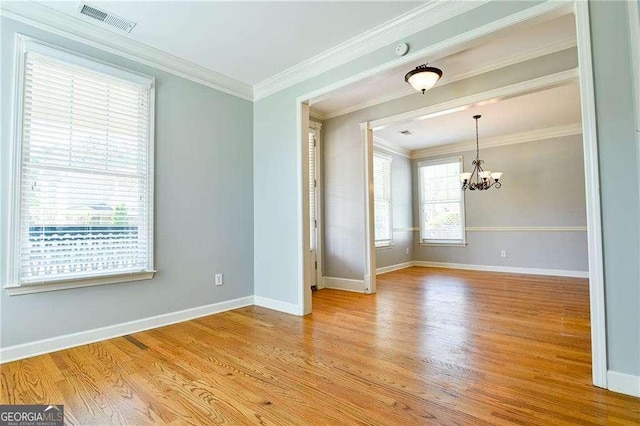 974 Regal Hills Ln, Mableton, GA 30126 - unfurnished room featuring baseboards, light wood finished floors, a notable chandelier, and visible vents