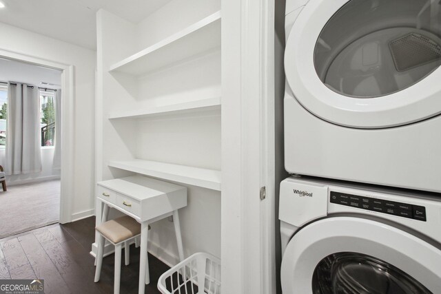 1050 Stacks Ave SE Unit 1507, Atlanta, GA 30315 - washroom featuring estacked washer and dryer and dark wood-style flooring