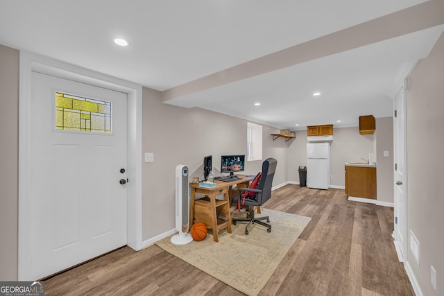 office space with wood finished floors, baseboards, and recessed lighting
