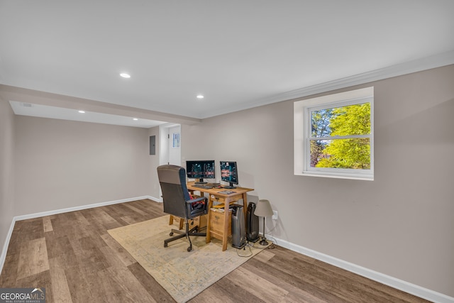 office space featuring baseboards, recessed lighting, and wood finished floors