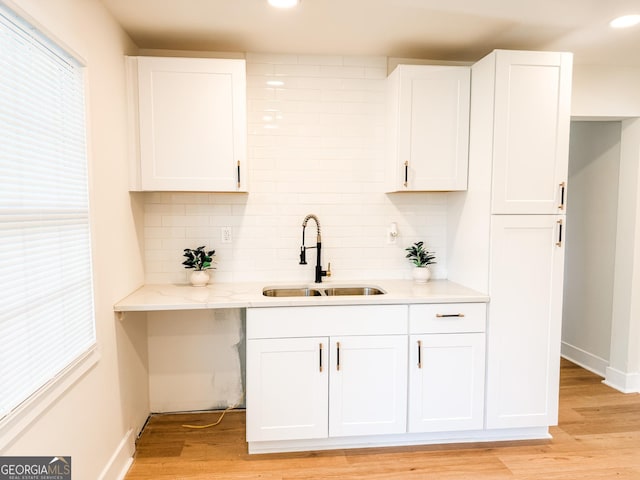 947 Reed Ave, East Point, GA 30344 - kitchen featuring a sink, tasteful backsplash, healthy amount of natural light, and recessed lighting