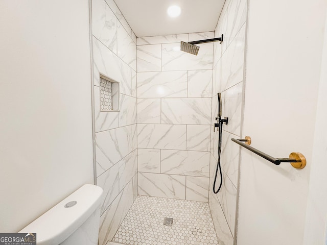 947 Reed Ave, East Point, GA 30344 - bathroom with a tile shower and toilet