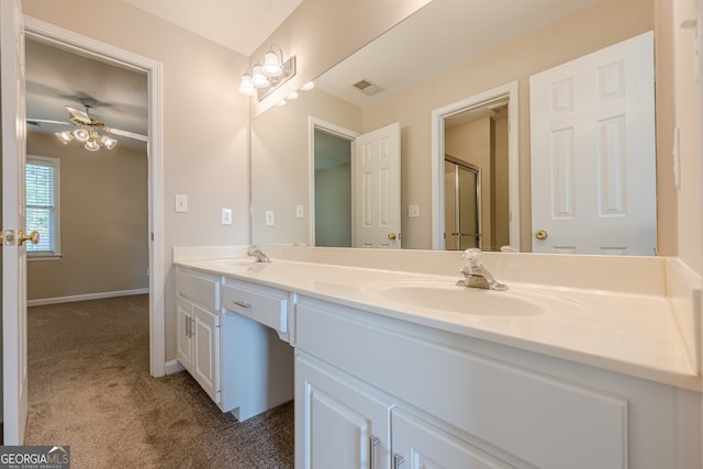full bath featuring a shower with door, double vanity, a sink, and visible vents