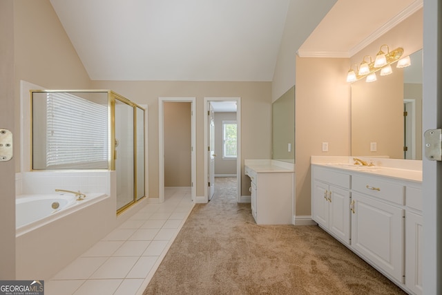 bathroom with a bath, a stall shower, vaulted ceiling, and vanity