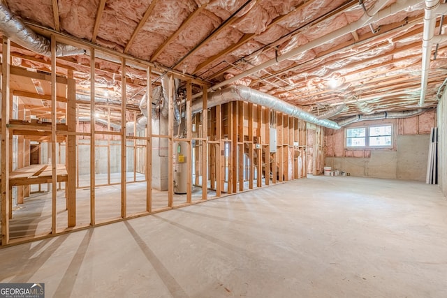 interior space featuring electric panel and water heater