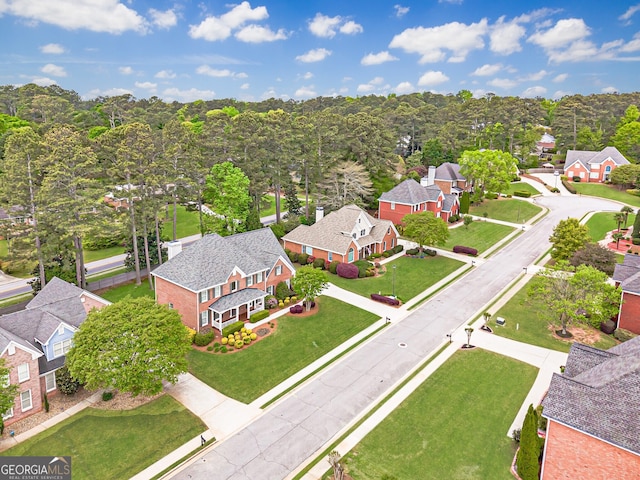 aerial view with a view of trees and a residential view