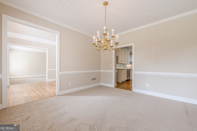 unfurnished dining area featuring a notable chandelier, baseboards, crown molding, and visible vents